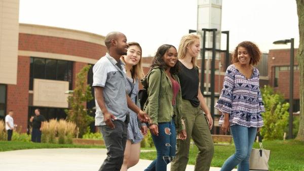 Students walking by GCC building